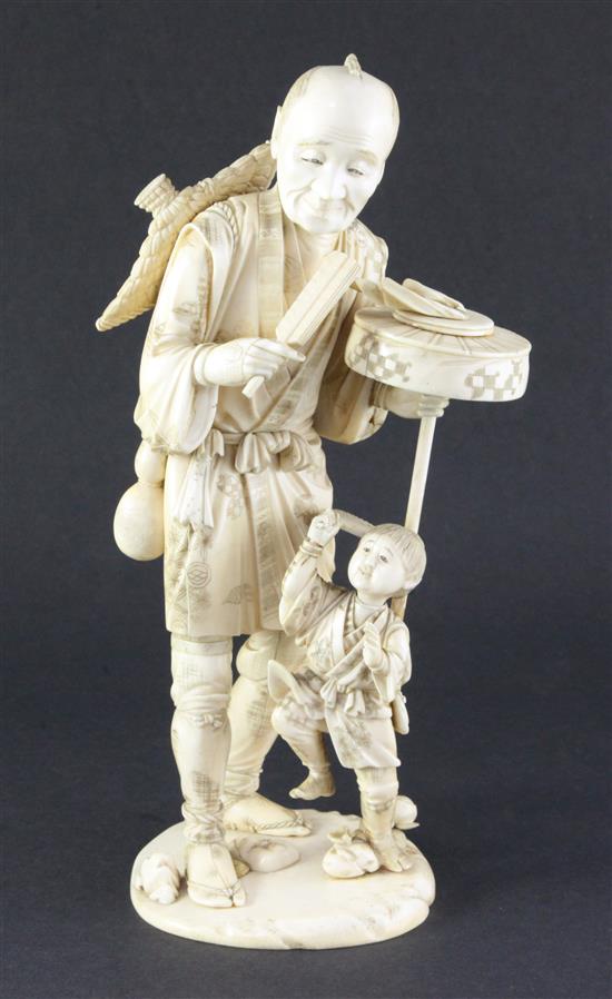 A large sectional ivory group of man and a boy, early 20th century, 30.5cm